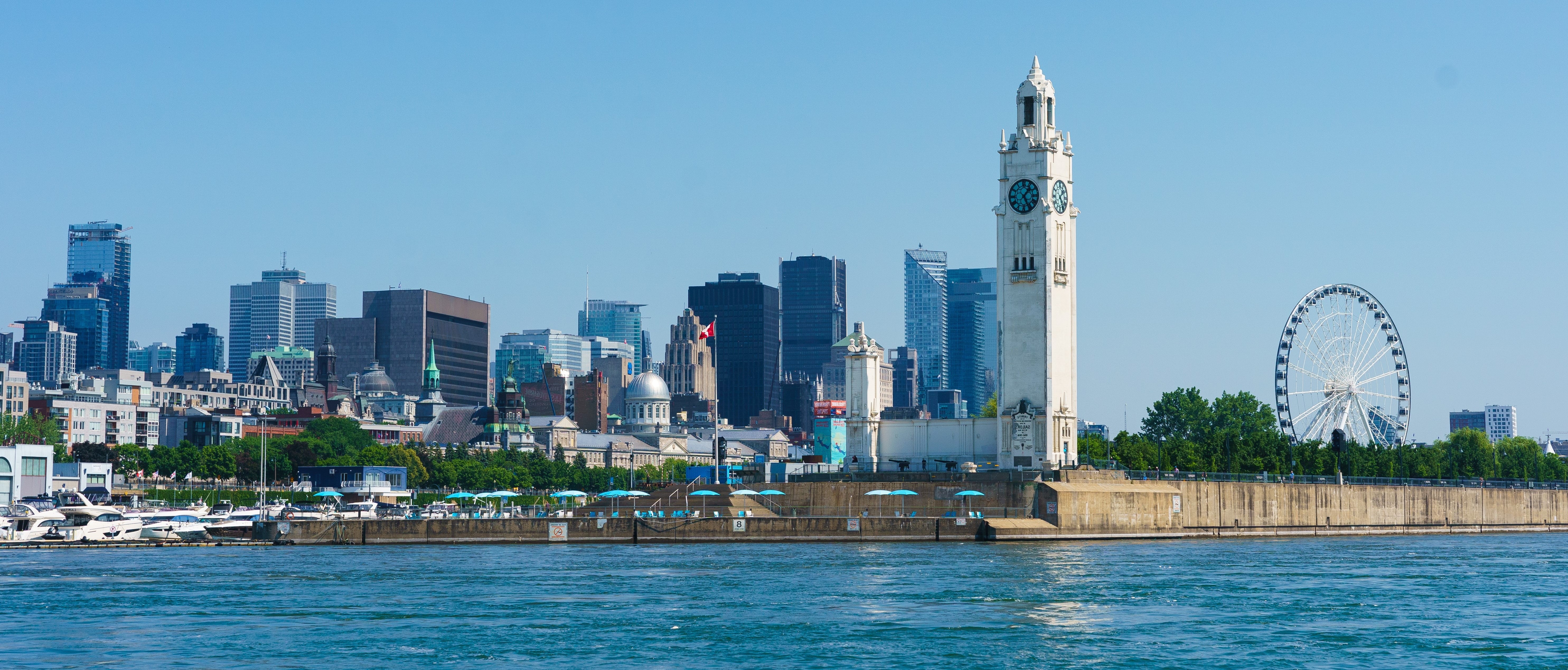 Shot of the Old Port of Montreal showing the clock tower and the cityscape in the background